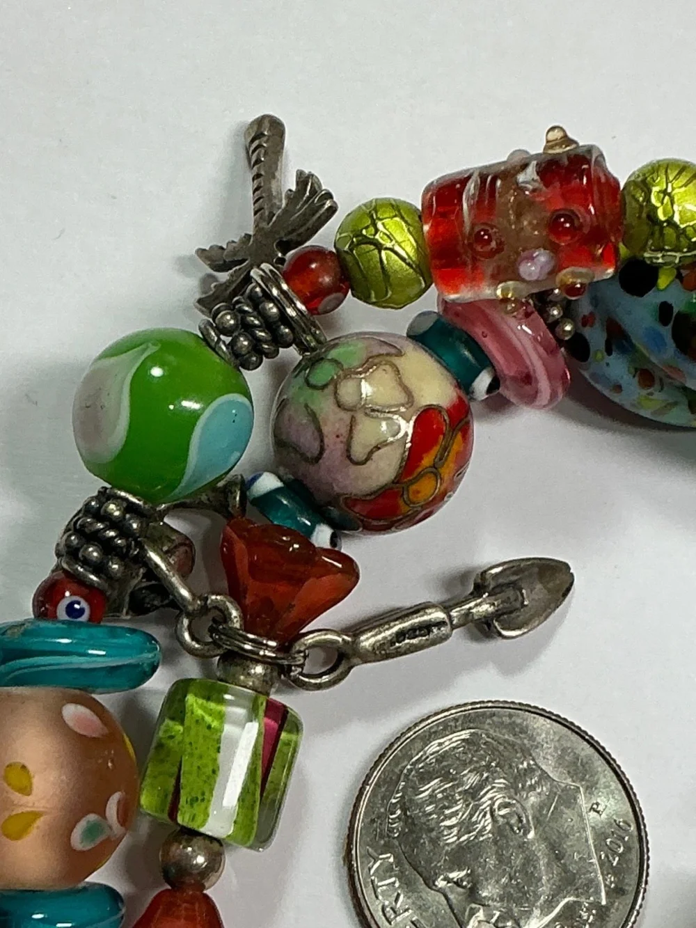 Sterling Silver and Lampwork glass beads W/ 4 Sterling Silver charms. 7.5” long